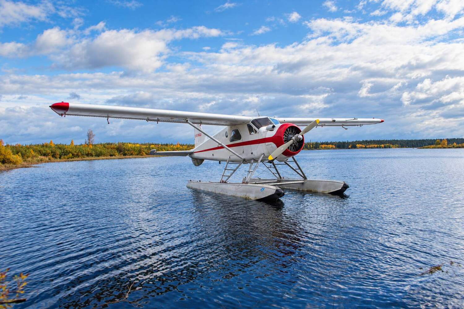Floatplane over bright blue Northwestern Ontario water