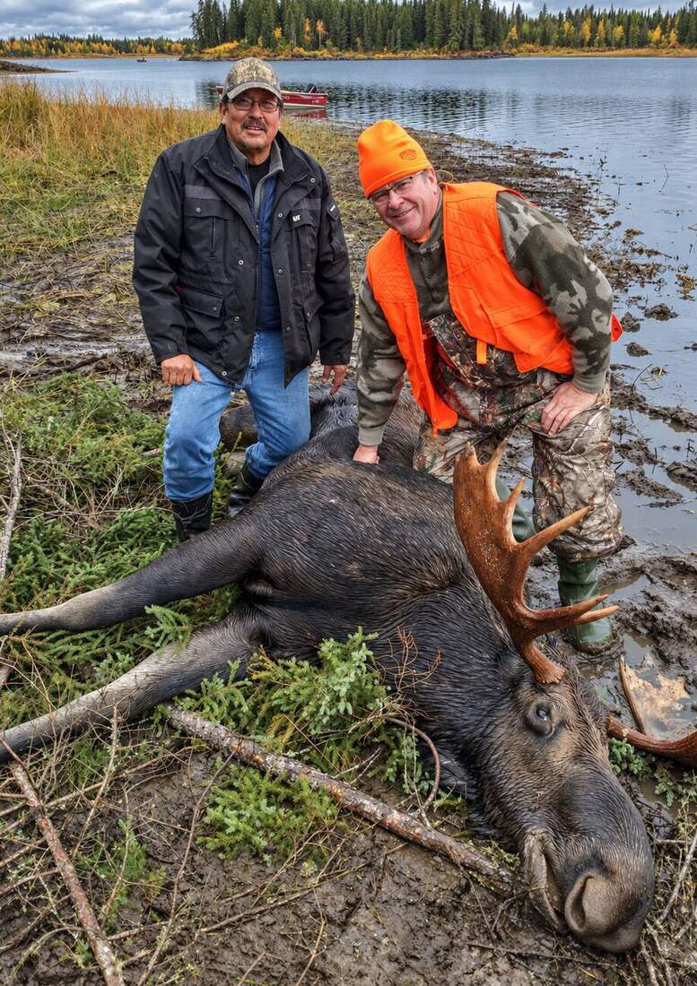 Hunters transporting a moose by red boat
